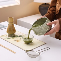 Produit transfrontalier très vendu : Bol à matcha en céramique Dehua de style japonais, motif lotus en relief et fleur de cerisier, fouet à matcha et outil à thé