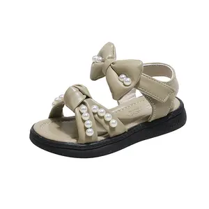 Kızların yay prenses sandalet 2024 yaz yeni yumuşak soled çocuk açık parmaklı plaj ayakkabısı