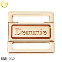 Conector de logotipo de metal personalizado respetuoso con el medio ambiente, herrajes de bikini con nombre hueco personalizado con correas de metal Bule, accesorios de baño OEM