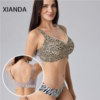 XIANDA OEM Soutien-gorge sans armatures personnalisé pour femme, en maille croisée unie, sans couture, avec crochet arrière surdimensionné, rembourrage push-up, soutien-gorge sans couture