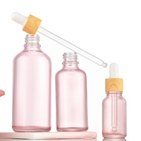 En stock mignon forme ronde rose bouteilles en verre 5ml-100ml vide cosmétique huiles essentielles emballage avec compte-gouttes