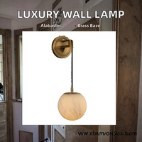 Applique murale LED en laiton de luxe moderne avec boule en albâtre naturel, installation encastrée pour les chambres d'hôtel et les espaces de luxe