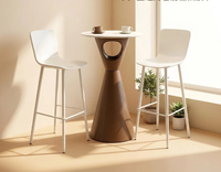 Table basse circulaire moderne minimaliste à pieds hauts pour l'extérieur, idéale pour les cafés et les espaces de loisirs