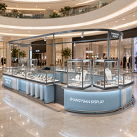 Ensemble de vitrines en verre pour kiosque à bijoux de centre commercial de luxe, comptoir incurvé, cadre en métal gris, projecteurs LED