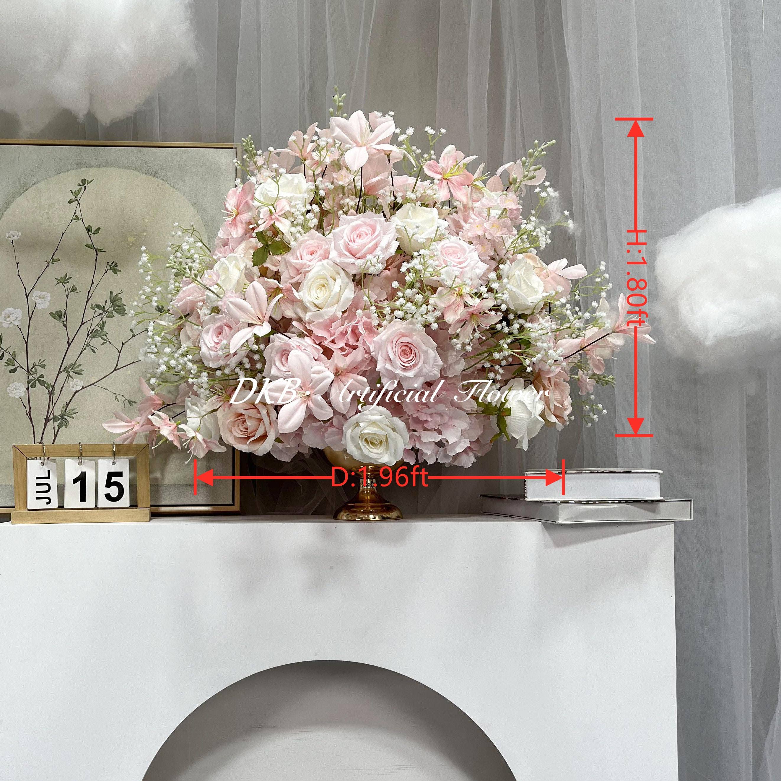 wedding flower arrangement around cake