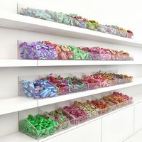 Présentoir design moderne personnalisé pour magasin de sucettes et de bonbons Éclairage LED populaire Décoration d'aliments sucrés Vitrine à vendre