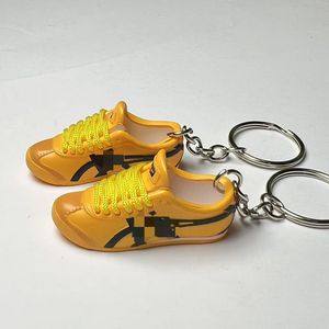 พวงกุญแจรูปรองเท้าไทเกอร์ 3 มิติ แบบโปร่ง รุ่นแฟชั่น  ของตกแต่งรูป<span class=keywords><strong>รองเท้า</strong></span>  จี้บรูซ <span class=keywords><strong>ลี</strong></span>  <span class=keywords><strong>รองเท้า</strong></span>กังฟูสีเหลือง  <span class=keywords><strong>รองเท้า</strong></span><span class=keywords><strong>ผ้าใบ</strong></span>ผู้ชาย - Product Image 3