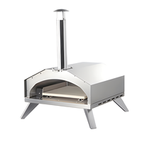 Four à pizza extérieur tout-en-un moderne en acier inoxydable sur chariot. Comprend une pelle à pizza et un allumeur à impulsions. Alimenté au gaz pour le jardin
