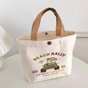Sac fourre-tout en toile à motif de dessin animé mignon avec fermeture à fermoir, portable et réutilisable, idéal pour le déjeuner d'été, les étudiants, le bureau, les pique-niques et le rangement quotidien - Product Image 3