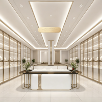 Solution complète d'aménagement de boutique de bijoux moderne et minimaliste : vitrine en verre blanc et or champagne, îlot incurvé