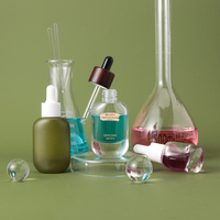 Flacon compte-gouttes en verre de luxe à fond épais de 15 ml et 30 ml avec logo personnalisé et estampage doré pour huiles essentielles, sérums et parfums vides
