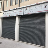 Porte à enroulement en acier robuste avec fonction antivol, porte roulante industrielle Qianou pour entrepôt, usine, prix bas