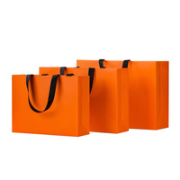 Bolsa de papel logotipo impreso personalizado ropa de lujo bolsas de papel de compras Boutique bolsa de papel de regalo reciclable con cuerda de cinta