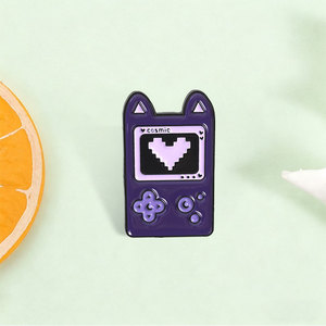 Épinglette en émail personnalisée Cosmic Cat Game Console, Badge métallique Kawaii Chat Violet Gameboy, Épinglette de revers Cœur Pixel, Cadeau pour Gamer - Product Image 1
