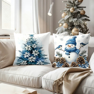 Bantal Natal dengan desain Santa, manusia salju, karangan bunga, dan pohon dalam warna biru dan putih yang nyaman. - Product Image 4