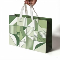 Sac de courses en papier kraft écologique et recyclable avec motif abstrait pour magasin de vêtements, personnalisable et luxueux