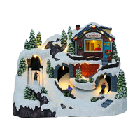 Village de Noël en résine avec lumières, sculpture peinte à la main, art populaire féerique musical, décor LED avec train et patineurs en mouvement