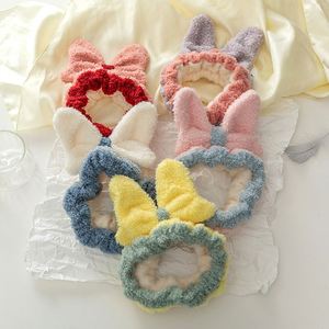 Serre-tête pour femme en polaire corail avec nœud papillon, style doux et minimaliste, populaire sur internet, idéal pour mariage, direct usine - Product Image 1