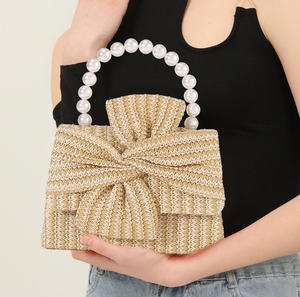 European and American spring and <b>summer</b> design sense pearl handbag fashion and versatile handmade bow women's woven straw <b>bag</b> - Product Image 1