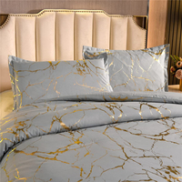 Nouvelle collection de couettes tendance, écologiques, à texture marbrée, mélangées avec du style feuille d'or métallique