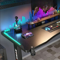 Bureau de jeu noir, poste de travail électrique réglable avec éclairage RGB, table de jeu ergonomique moderne