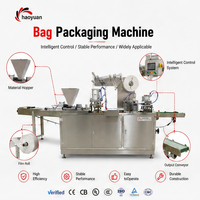 Machine d'emballage professionnelle à performance stable avec contrôle PLC pour l'emballage de bonbons, biscuits, pain et autres produits alimentaires en sachets de type oreiller