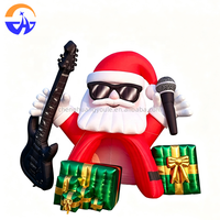 Arche gonflable géante Père Noël rockeur avec guitare, microphone et boîtes cadeaux pour l'entrée de centre commercial, la cour ou les événements de Noël