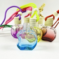 Échantillon gratuit de bouteille de parfum de voiture en verre transparent en forme de pomme corde personnalisée bouteille de désodorisant de voiture de parfum suspendu vide