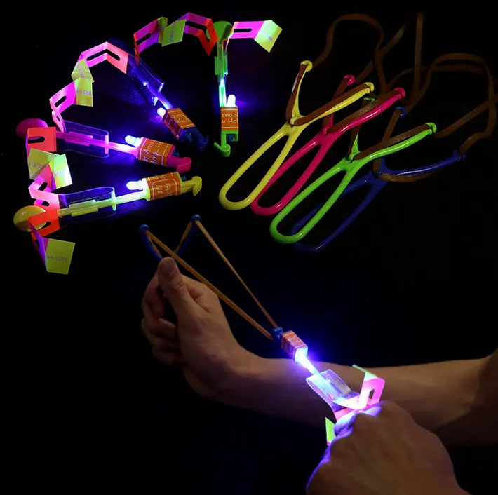 Juguete luminoso para niños, tirachinas LED, flecha voladora, catapulta, venta al por mayor