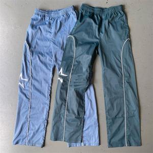Vente en gros Streetwear personnalisé pantalon en nylon réfléchissant pantalon de survêtement évasé Patchwork ceinture élastique broderie piste pantalon pour hommes - Product Image 1