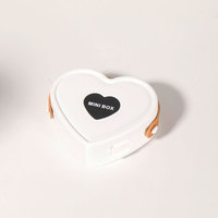 Boîte à bijoux en plastique en forme de cœur avec miroir, design compact, fermeture à boucle, motif uni, pour ranger colliers, bagues, idéale pour les voyages