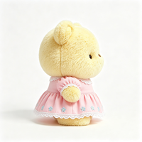 Ours en peluche compact Kawaii avec tenue à volants et imprimé floral, texture douce et bouclée, jouet en peluche animal en peluche