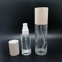 Botella de Vidrio Transparente para Cosméticos y Cuidado de la Piel con Tapa de Madera de Fresno y Pulverizador de Vidrio para Suero y Aceites