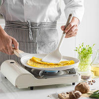 Vente en gros d'accessoires de cuisine chauffants outils de cuisine nouveauté blanche ustensile de cuisine en silicone avec support vente en gros