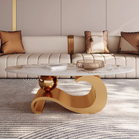 Nouvelle table basse ovale en marbre avec structure métallique, plateau en dalle de roche durable, style luxe léger et moderne pour salon domestique