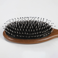 Brosse à cheveux ovale en bois de noyer avec coussin d'air, poils de sanglier mélangés et picots en nylon, pour démêlage, massage du cuir chevelu et coiffage, vente en gros