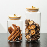Vente en gros de nouveaux pots de conservation en verre de qualité alimentaire de style chinois avec couvercle en bois hermétique et résistant à l'humidité, couvercles en bambou pour le thé et les pelures de mandarine
