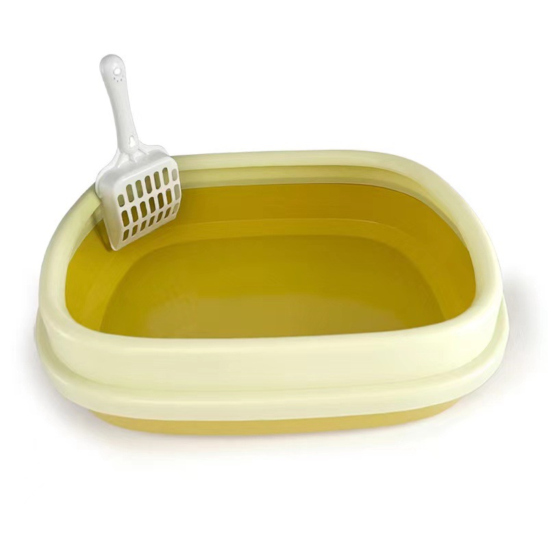 Medium-sized (yellow) open litter box with scoop