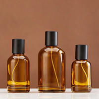 Flacon pulvérisateur rond en verre brun ambré avec pulvérisateur noir, conteneur de parfum vide, plusieurs tailles, vente en gros