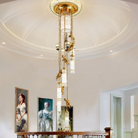 Lustre long européen en laiton de luxe avec pendentifs en cristal français pour escalier, luminaire suspendu en grappe
