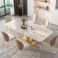 Ensemble de table à manger Wayon Luxury Gold avec plateau en pierre frittée brillante, base géométrique en métal et chaises rembourrées