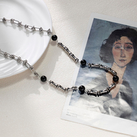 Collier Mlluki en acier inoxydable avec motif os, noir et blanc, style hip-hop, bijoux en pierre naturelle noire pour femme, idéal comme cadeau