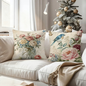 Bantal hias bermotif bunga dan burung bergaya vintage menghiasi sofa ruang tamu yang nyaman dengan kaus kaki Natal yang meriah di latar belakang. - Product Image 4