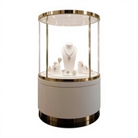 Vitrine de présentation de bijoux ronde moderne, design de comptoir de magasin de bijoux, mobilier de magasin de bijoux en or et diamants