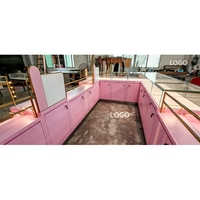 Kiosque à bijoux de luxe rose doré, aménagement en L personnalisé avec bandes lumineuses LED pour les marques de centres commerciaux