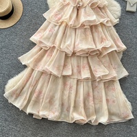 Robe sans manches élégante pour femme, style vacances à la française, avec volants superposés et taille cintrée, collection 2026, vente en gros, fabricants de vêtements