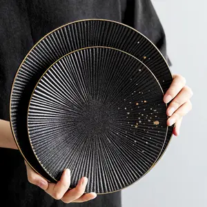 Opaca Claytan nero porcellana stoviglie oro bordo cena stoviglie all'ingrosso piatto in ceramica per ristorante dell'hotel