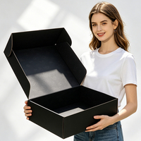 Boîte d'emballage d'expédition pour vêtements en carton ondulé noir recyclé écologique avec logo personnalisé et protection en mousse, vente en gros