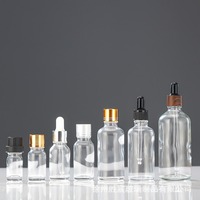 Bouteille cosmétique en verre dépoli transparent de 15ml personnalisée avec pipette compte-gouttes vide en or noir blanc pour sérum à l'huile et crème de soin de la peau