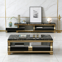 Table basse de luxe en marbre noir avec espace de rangement pratique et piètement en acier inoxydable doré pour salon